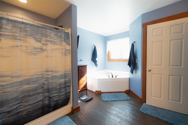 bathroom with separate shower and tub and hardwood / wood-style floors