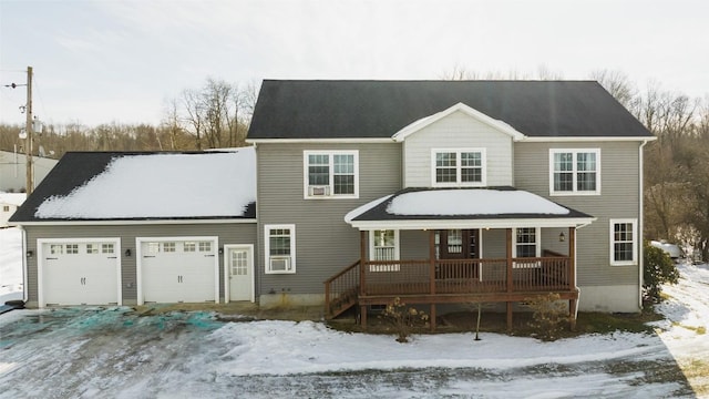 view of front facade with a garage and covered porch