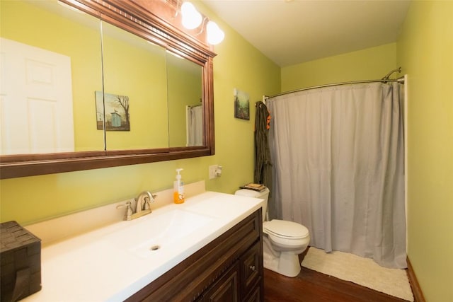 bathroom featuring vanity, toilet, and a shower with shower curtain