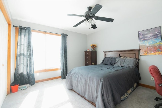 bedroom with light colored carpet and ceiling fan