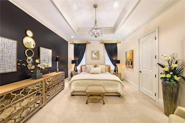 bedroom featuring a tray ceiling, light carpet, crown molding, and a chandelier