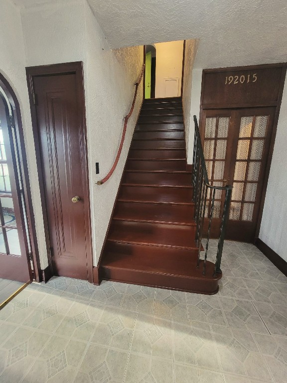 stairway with french doors