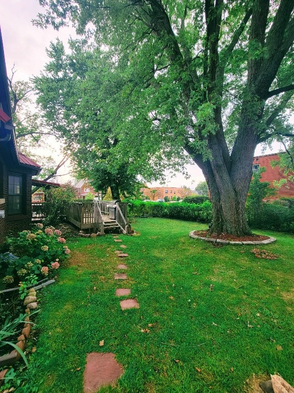 view of yard with a wooden deck