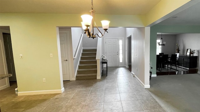 2906 N Birch Run, Erie, PA 16506 - foyer entrance featuring a chandelier, light tile patterned floors, baseboards, and stairway