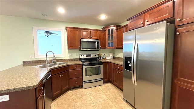 2906 N Birch Run, Erie, PA 16506 - kitchen featuring stainless steel appliances, a sink, glass insert cabinets, light tile patterned flooring, and dark countertops