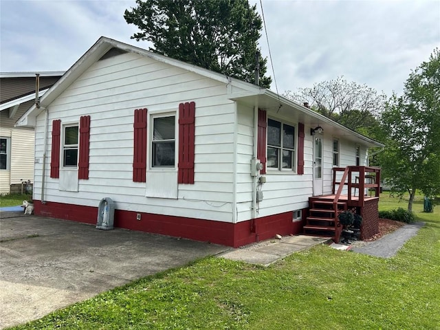 315 Wallace Ave, Linesville, PA 16424 - view of home's exterior with a yard, crawl space, a patio, and a wooden deck