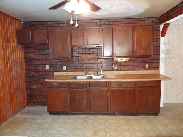 kitchen with wood walls and sink