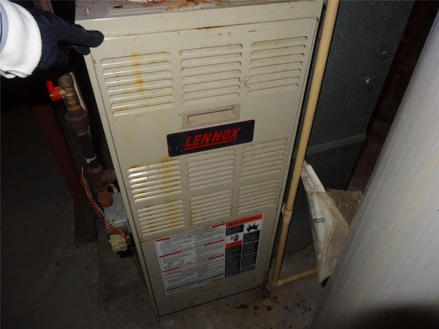 utility room with heating unit