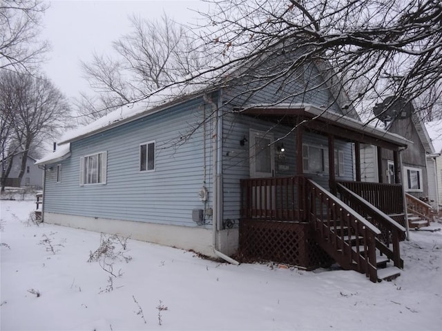 view of snow covered house