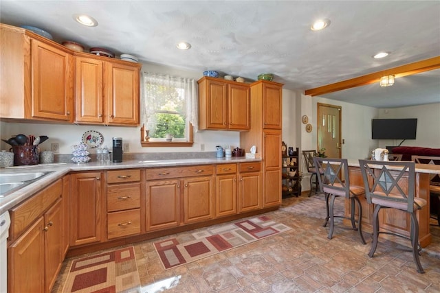 6946 Huntley Rd, West Springfield, PA 16443 - kitchen with light countertops, recessed lighting, brown cabinets, white dishwasher, and open floor plan