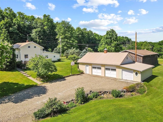 6946 Huntley Rd, West Springfield, PA 16443 - view of front of property featuring a garage, an outdoor structure, a chimney, and a front yard