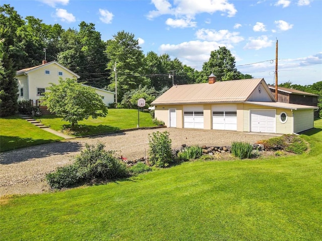 6946 Huntley Rd, West Springfield, PA 16443 - view of home's exterior featuring a garage, a lawn, an outbuilding, and a chimney