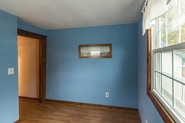 unfurnished room featuring hardwood / wood-style floors