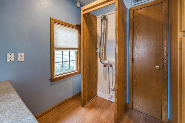 hallway featuring light wood-type flooring