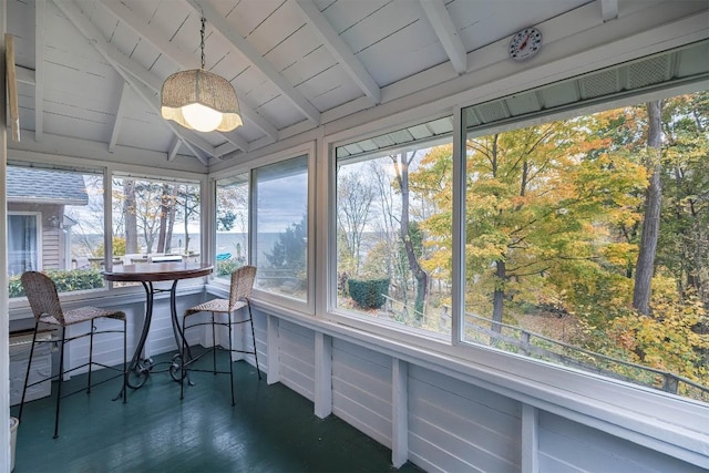 sunroom with lofted ceiling with beams and wood ceiling