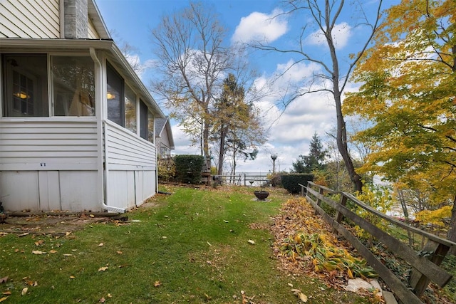 view of yard featuring a sunroom