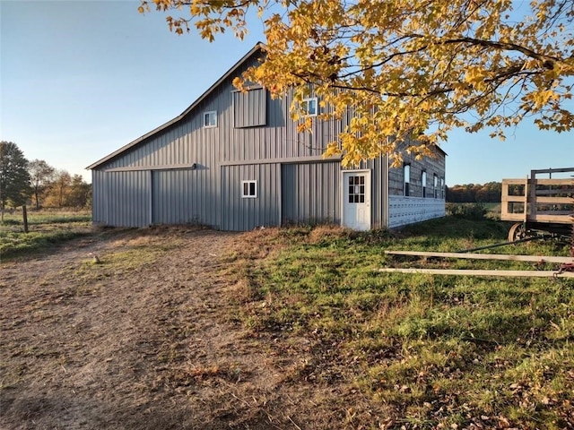 back of property with an outdoor structure