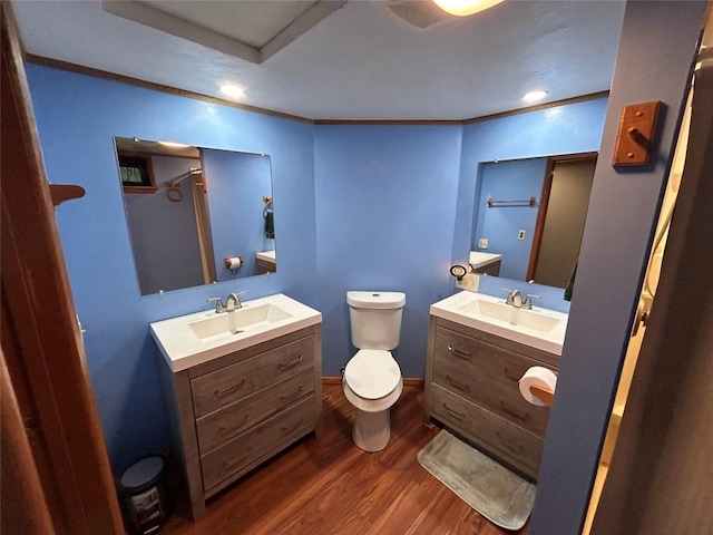 2892 Township Rd, Linesville, PA 16424 - full bathroom with wood finished floors, toilet, two vanities, ornamental molding, and a shower