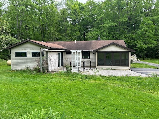 2892 Township Rd, Linesville, PA 16424 - single story home featuring a front yard and a sunroom