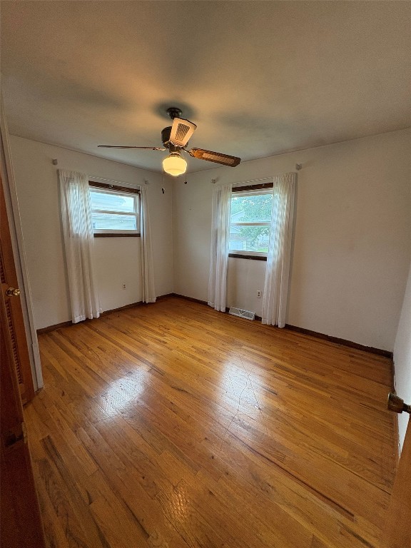 2810 E 28th St, Erie, PA 16510 - spare room featuring plenty of natural light, light wood-style flooring, and ceiling fan