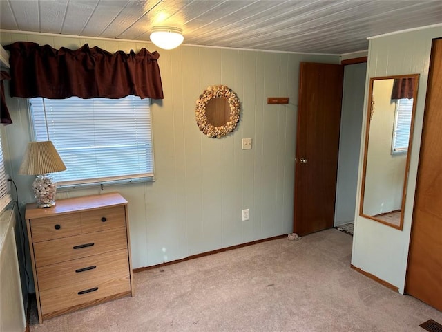 unfurnished bedroom featuring light colored carpet