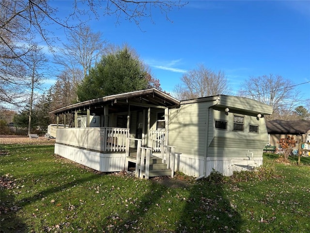 exterior space with a porch and a lawn