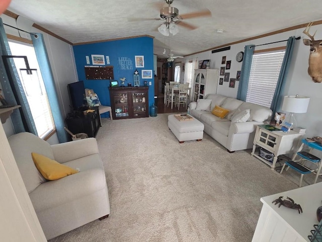 2719 Green Hill Dr, Millcreek, PA 16506 - carpeted living room featuring a ceiling fan, ornamental molding, and vaulted ceiling