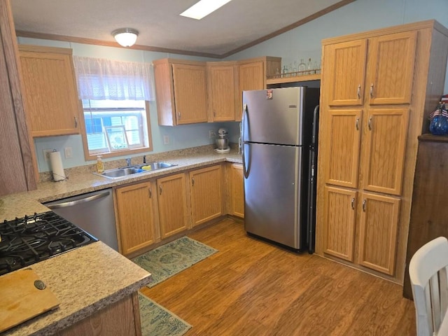 2719 Green Hill Dr, Millcreek, PA 16506 - kitchen with freestanding refrigerator, lofted ceiling, ornamental molding, dishwashing machine, and light wood-style flooring