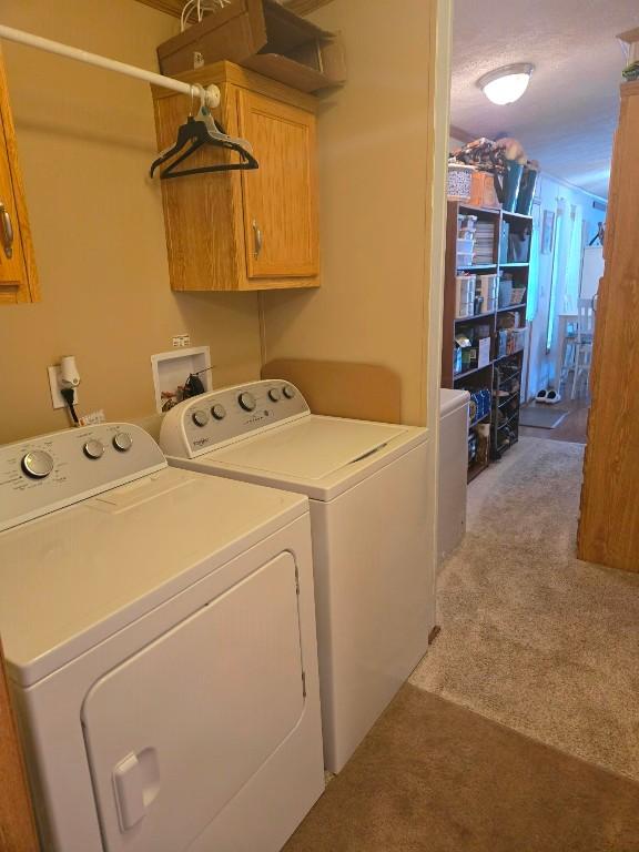 2719 Green Hill Dr, Millcreek, PA 16506 - washroom with washer and dryer, cabinet space, and light colored carpet