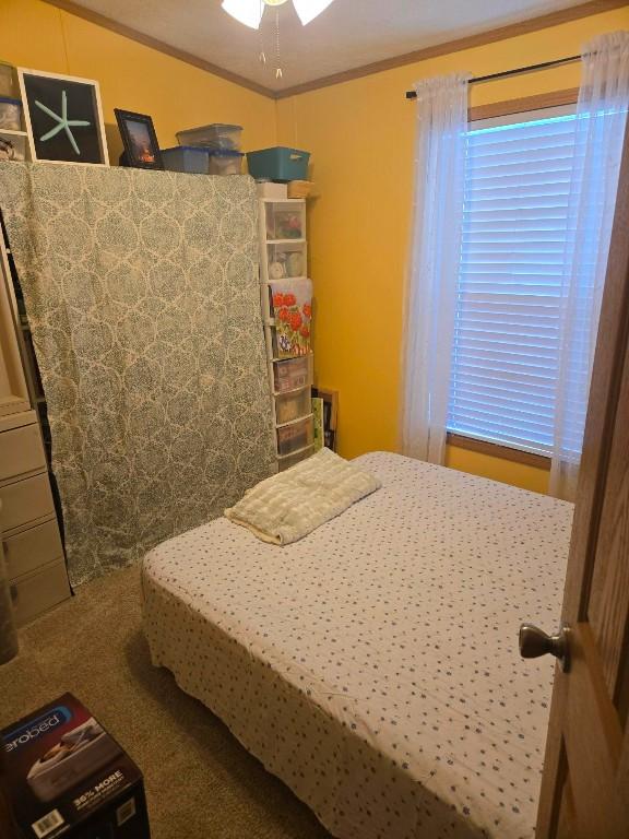 2719 Green Hill Dr, Millcreek, PA 16506 - bedroom featuring crown molding and carpet flooring