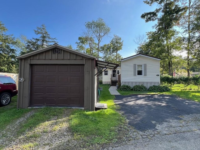 garage featuring a lawn