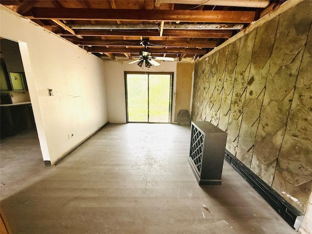 unfurnished living room with ceiling fan