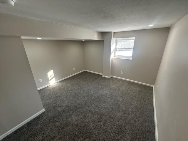 empty room with dark carpet