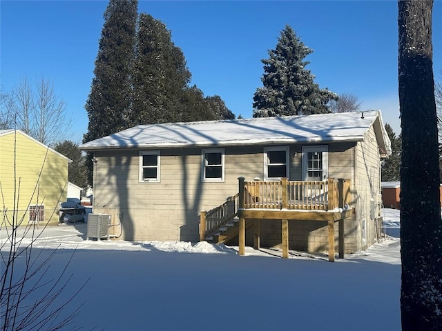 exterior space with cooling unit and a wooden deck