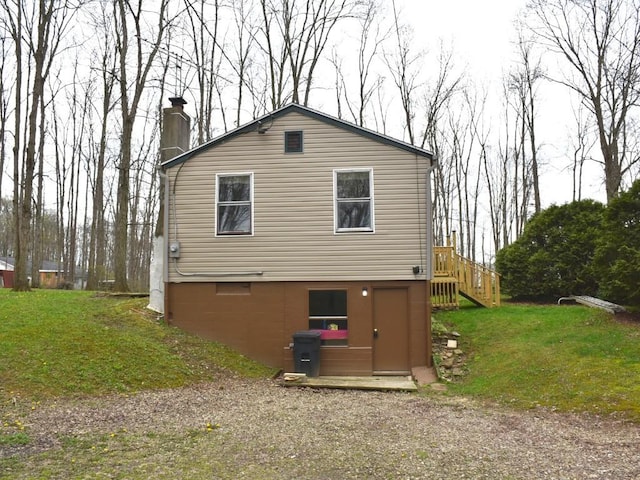 12322 N Watson Run Rd, Conneaut Lake, PA 16316 - rear view of house with a lawn and a chimney