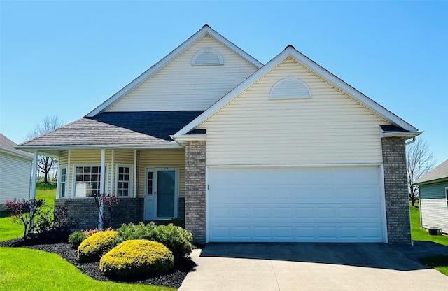 view of front facade with brick siding, concrete driveway, and an attached garage