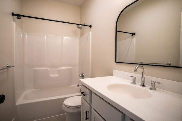 full bathroom featuring bathtub / shower combination, vanity, and toilet