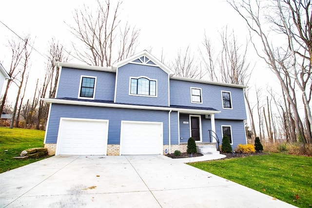 view of front of property with a front yard and a garage