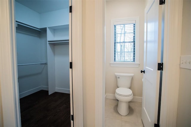 bathroom featuring tile patterned flooring and toilet