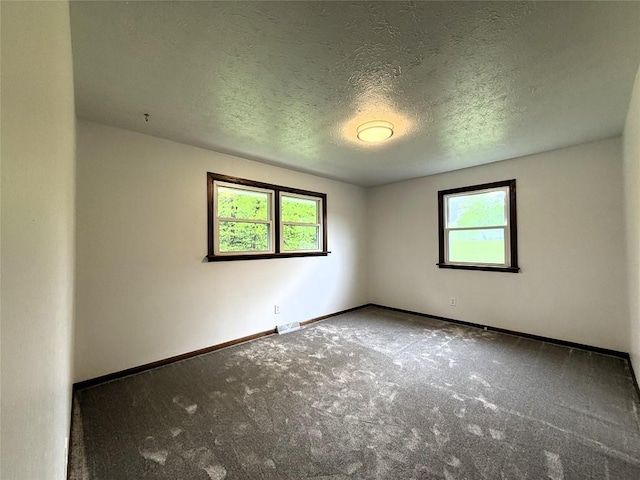 31050 US Highway 322, Cochranton, PA 16314 - carpeted spare room featuring a textured ceiling and baseboards