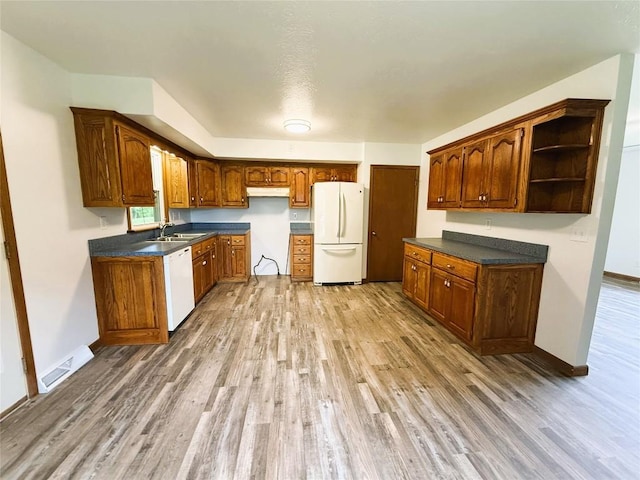 31050 US Highway 322, Cochranton, PA 16314 - kitchen with white appliances, light wood-style floors, a sink, and dark countertops