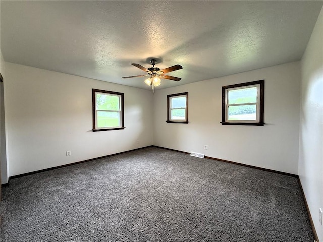 31050 US Highway 322, Cochranton, PA 16314 - unfurnished room with a textured ceiling, ceiling fan, dark carpet, and baseboards