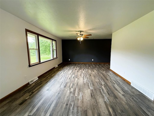 31050 US Highway 322, Cochranton, PA 16314 - unfurnished room featuring a ceiling fan, dark wood finished floors, and baseboards