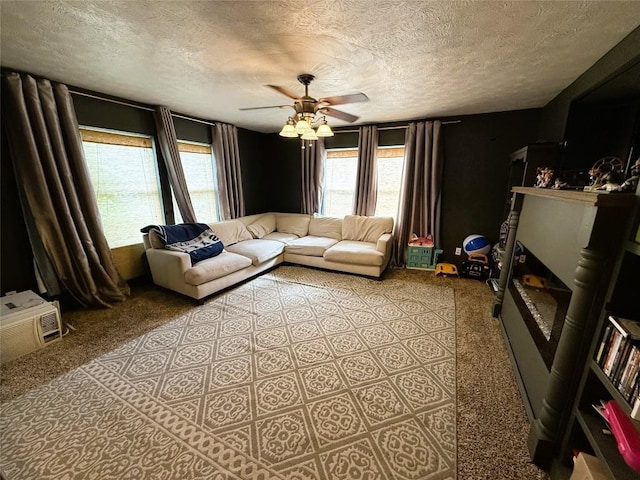 10537 Franklin Pike, Meadville, PA 16335 - living room with a textured ceiling, ceiling fan, a glass covered fireplace, and carpet flooring