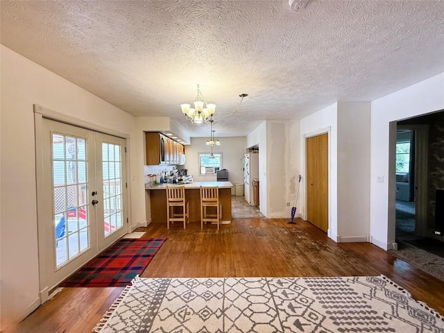 10537 Franklin Pike, Meadville, PA 16335 - kitchen with a chandelier, hardwood / wood-style flooring, french doors, light countertops, and a textured ceiling