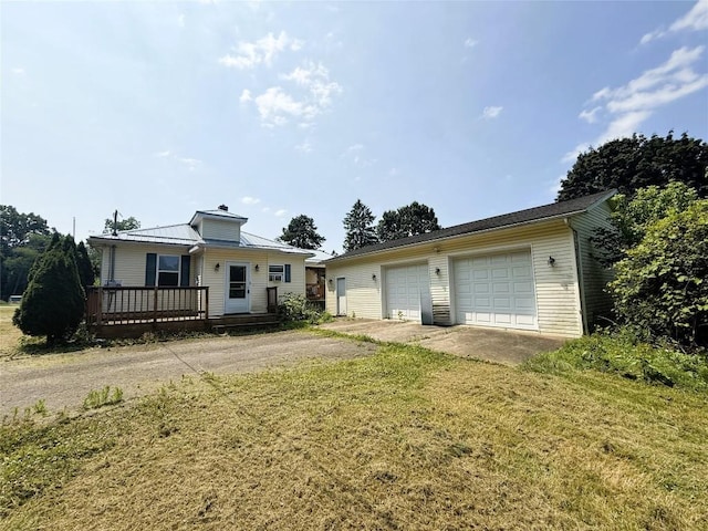 10537 Franklin Pike, Meadville, PA 16335 - view of front of house with a wooden deck, a garage, a front lawn, and a chimney