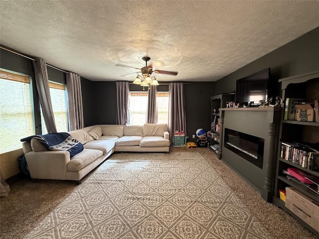 10537 Franklin Pike, Meadville, PA 16335 - living area featuring a glass covered fireplace, a textured ceiling, light colored carpet, and a ceiling fan
