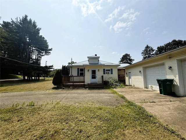 10537 Franklin Pike, Meadville, PA 16335 - view of front of home featuring concrete driveway, a deck, a garage, and a chimney