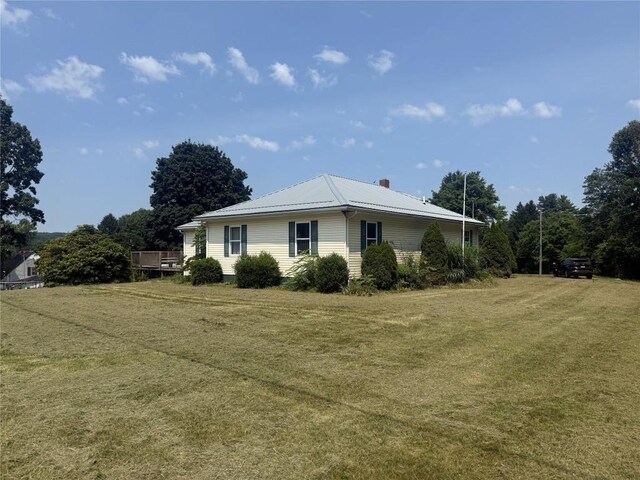 10537 Franklin Pike, Meadville, PA 16335 - view of property exterior with a lawn, a metal roof, and a chimney