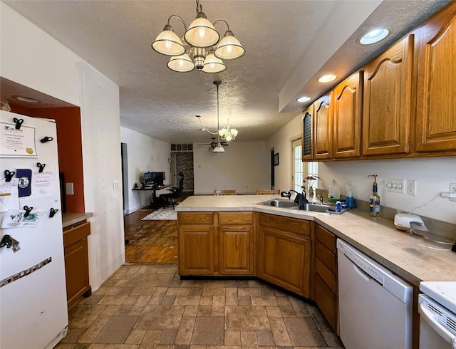 10537 Franklin Pike, Meadville, PA 16335 - kitchen with white appliances, a chandelier, a peninsula, stone tile flooring, and light countertops